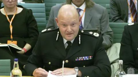 House of Commons Chief Constable Craig Guildford sits in the House of Commons 