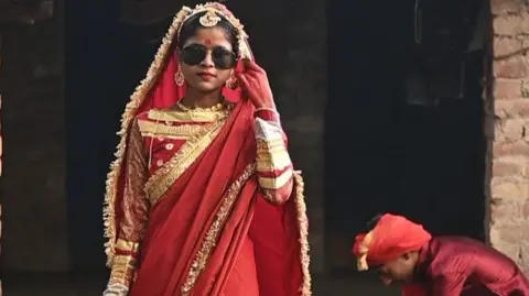 A girl from an Indian slum models at a fashion show that has gone viral