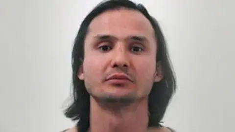 Police Scotland A mugshot of Sadeq Nikzad who had long shoulder length black hair and a moustache Police Scotland A mugshot of Sadeq Nikzad who had long shoulder length black hair and a moustache