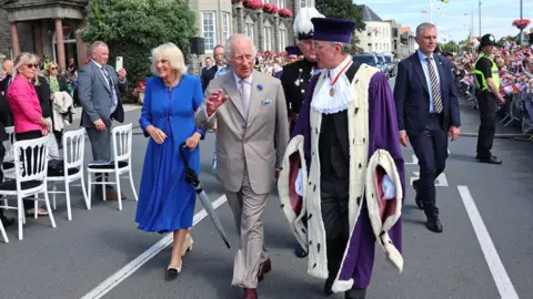 PA Media King Charles III and Queen Camilla arrive to attend the special sitting of the States of Deliberation, at the Guernsey Parliament in Saint Peter Port, Guernsey, during their two day visit to the Channel Islands.