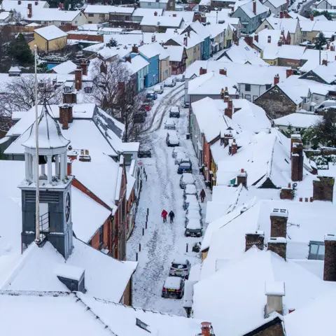 Mike Olivant An elevated view of snowy roofs and streets in Bishop's Castle