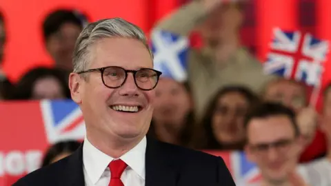 Reuters Keir Starmer, leader of Britain's Labour party, reacts as he addresses his supporters at a reception to celebrate his win in the election, at Tate Modern, in London, Britain, July 5, 2024.