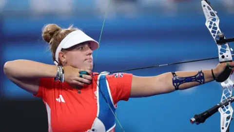 Reuters Megan Havers using a bow in competition at Paris 2024