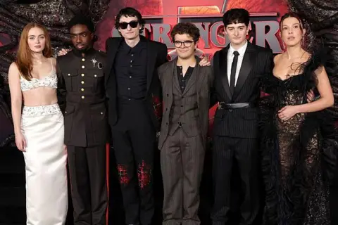 Getty Images Sadie Sink, Caleb McLaughlin, Finn Wolfhard, Gaten Matarazzo, Noah Schnapp and Millie Bobby Brown in smart clothes at the premiere