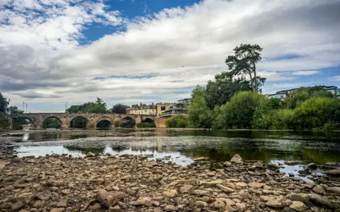 Getty Images The river bed of the River Wye is seen exposed after weeks of no rainfall on 25th July 2026.