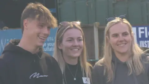 Lauren Hemp smiling at camera with fans