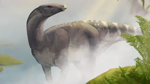 An illustration of the dinosaur. It is walking on its all-fours through a jungle landscape. The dinosaur is grey in colour.