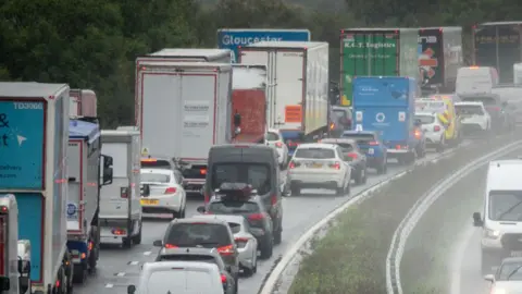 Two lanes of motorway congestion queue on a motorway. 