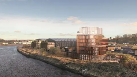 A CGI of how Crown Works Studios could look once built. A large glass building stands overlooking the river. Next to it are large warehouse-like structures. The nearest one has Studio 7 painted across one of its outer walls.