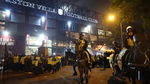 Reuters Police, including three on horseback outside Villa Park