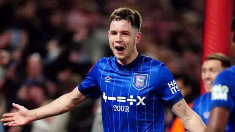 Mike Egerton/PA Wire George Hirst celebrating scoring a goal wearing the previous Ipswich Town shirt