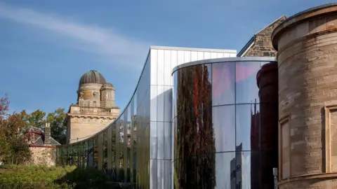 Paisley Museum exterior including the new building extension and red glass entrance.