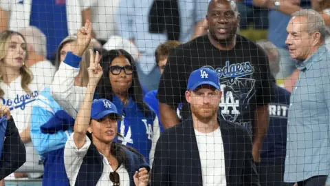 Reuters Prince Harry and Meghan at a baseball game in Los Angeles last week
