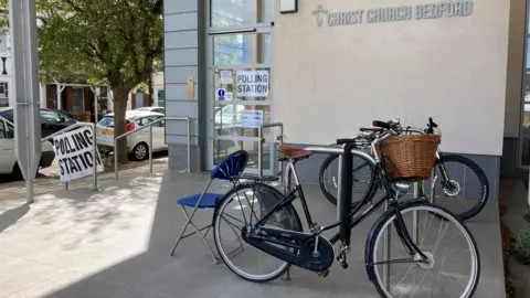 Bikes are left outside a polling station at Christ Church, Bedford