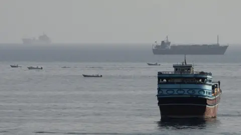 Vessels in the Strait of Hormuz, as seen from Musandam, Oman, August 3, 2026