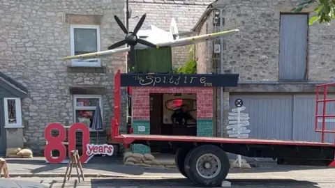 Spitfire replica in position outside house