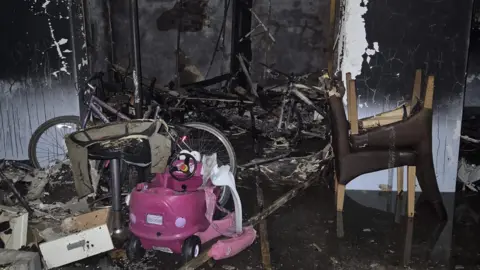 Alysha McLean The communal drying room in the block of flats showing fire damage.