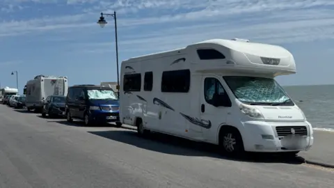 George King/BBC Parked vehicles including motorhomes and campervans on Felixstowe seafront.