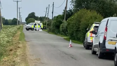 Police in a lane in Little Steeping after reports of a shooting