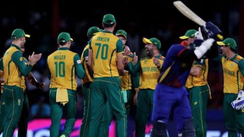 South Africa players celebrate a run out to beat Nepal at the 2024 T20 World Cup