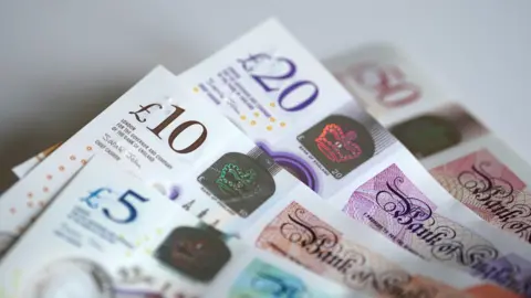 Charlie Le Noury A close up of 5, 10, 20 and 50 pound English notes