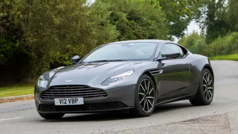 An Aston Martin on an English country road