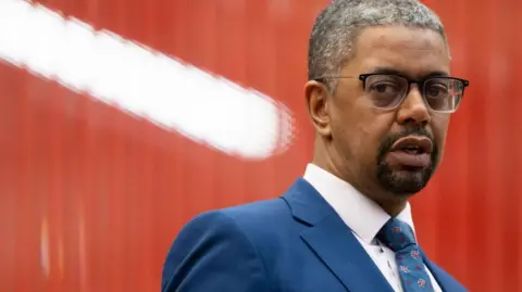 Getty Images Vaughan Gething wearing a blue suit