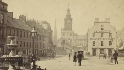 Getty Images An old picture of Dumfries town centre looking up towards the Midsteeple