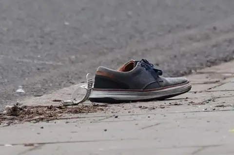 Jacob King/PA Wire Watch and shoe