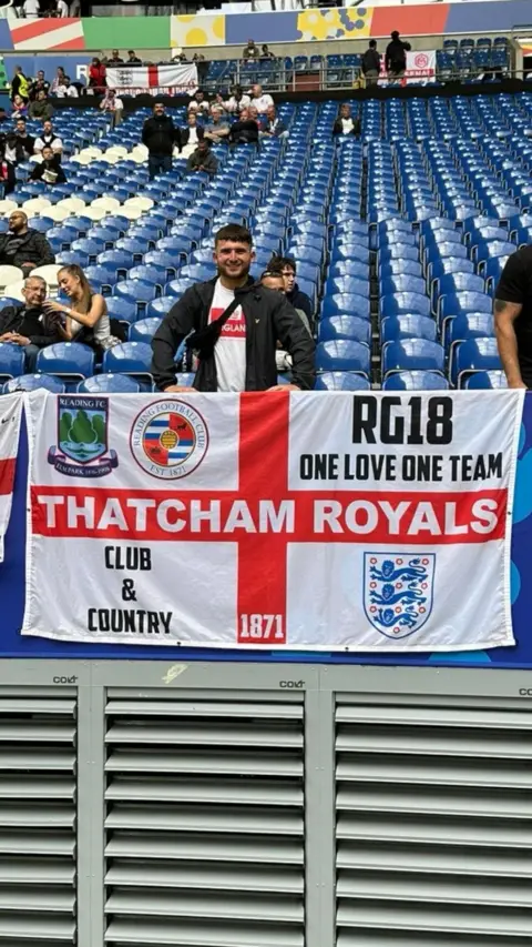 Charlie Richardson with his 'Thatcham Royals' (written across the horizontally on the St George's cross) flag at the Arena AufSchalke in Gelsenkirchen.