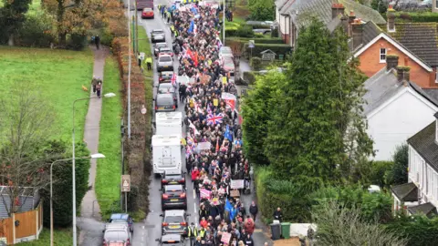 Eddie Mitchell A large group of people walking down a street in Crowborough