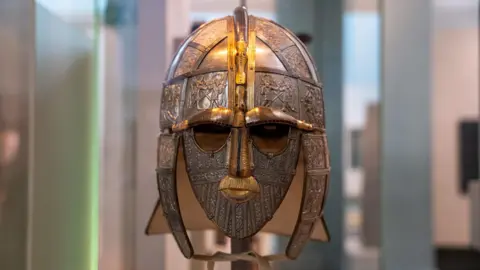 Kent County Council A decorative helmet on display in a museum case