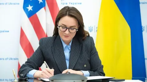 Ukraine's economy minister Yulia Svyrydenko signs a memorandum of intent for a minerals deal with the US in Kyiv, Ukraine on 18 April 2025.