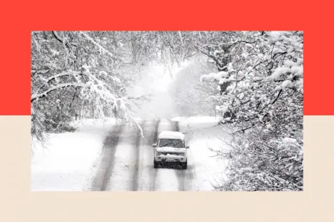PA A vehicle is driven along a snow covered road in Scotton, Harrogate, North Yorkshire.