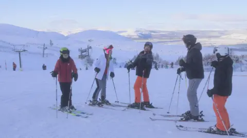 JJLove Productions Actress Caprice and her co-stars are pictured in a scene from the movie on the slopes of Aviemore in skiing outfits.