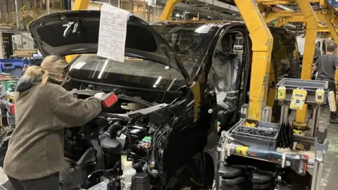 Work going on fitting out cars at Vauxhall's factory in Luton