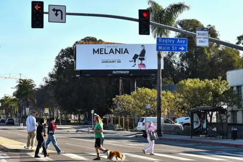 Getty Images A billboard on a busy street in LA advertises the film Melania 