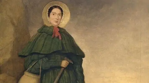 Natural History Museum Painting of Mary Anning, who wears a bulky coat and bonnet and is carrying a bag and a fossil-collecting hammer