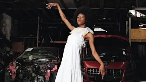 Christian Emanuel Art piece of woman in a scrap yard