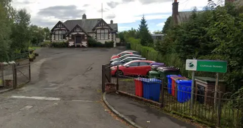 Google A detached house with a yard and car park at the front