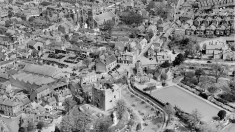 Historic England A black and white areal view of Guildford.