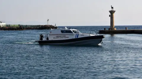 Hellenic Coast Guard A helicopter and coastguard ships are continuing the search for any further survivors (File photo).