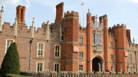 The red-brick front entrance of Hampton Court Palace.