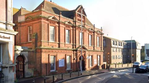 Outside view of Grade II listed building Folkestone Library on Grace Hill
