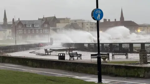 BBC Weather Watcher Kenneth Waves and spray on a seafront