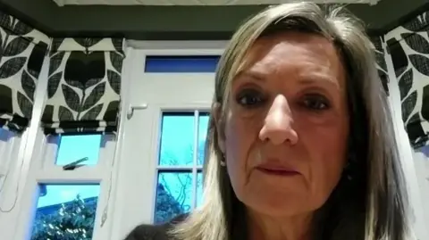 Roberta Armstrong Roberta Armstrong. She has shoulder length blonde hair, wearing a black jumper with white shirt underneath. An window is behind her.