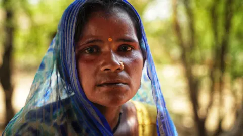 Seraj Ali Mamta looks into the camera outside her home in Bundelkhand