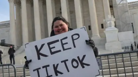 A person holds a placard outside the US Supreme Court on 10 January 2025