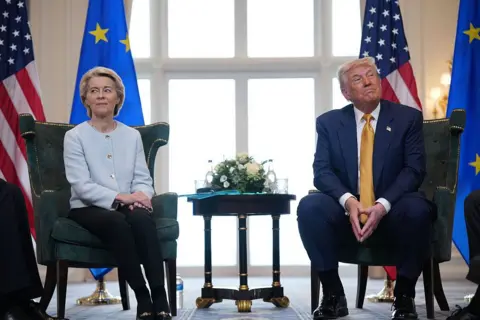 Getty Images Ursula von der Leyen and President Donald Trump sitting on two green chairs looking at each in a different direction
