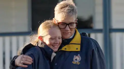 Chrissy Walters and her daughter Mia hug